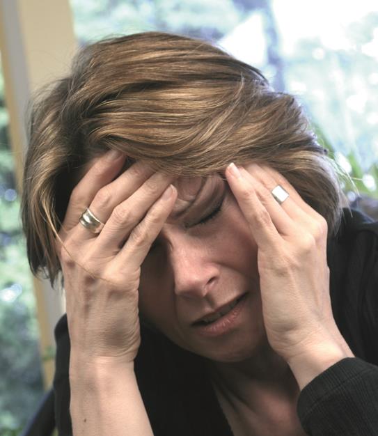 Kopfschmerzen zählen zu den Symptomen des PMS